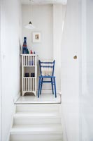 Classic wooden chair and storage unit on landing