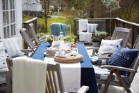 Outside dining table and chairs ready for entertaining 