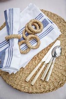 Detail of napkins, rings and cutlery
