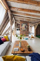 Open plan living space with exposed beams