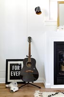 Detail of guitar in modern living room
