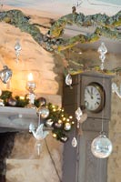 Detail of Christmas hanging decorations with grandfather clock