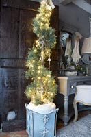 Christmas tree in vintage styled bedroom