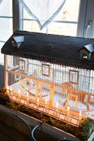 Detail of illuminated model house