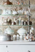 Detail of serving dishes on shelves