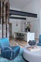 Modern blue armchair in open plan living area