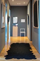 Modern black rug in the hallway