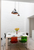 Dining area with 3D faux brick wallpaper 