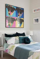 Colourful artwork on bedroom wall