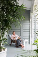 Vanessa Owen, owner sitting on the veranda
