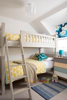 Wooden bunk beds in childrens bedroom