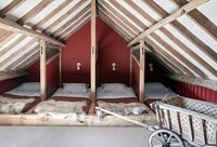 Rustic wooden attic bedroom