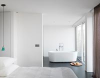 Open plan bedroom with bath