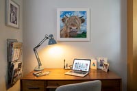 Home office with cow picture