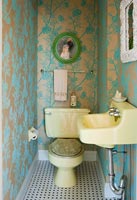 Classic cloakroom with yellow toilet and basin