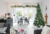 Modern open plan living area decorated for Christmas 
