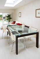 Modern glass topped dining table