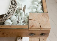 Detail of cutlery on rustic dining table