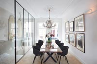 Contemporary dining room with glass wall