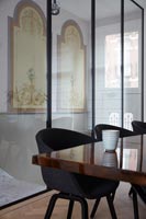 Detail of contemporary dining room glass wall