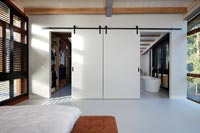 Contemporary bedroom with walk in wardrobe and ensuite bathroom