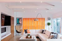 Modern white corner sofa in eclectic living room 