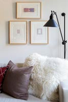 Fluffy cushion and lamp in modern living room 
