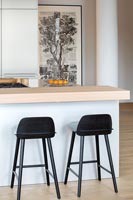 Black kitchen stools in modern kitchen
