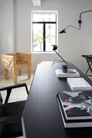 Modern black desk and quirky wooden armchair 