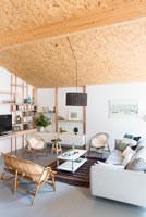 Modern living room with sloping cork covered ceiling 
