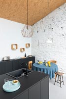 Modern kitchen-diner with small dining table 