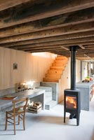 Lit wood burning stove in a modern living room