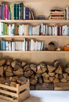 Bookshelves with log store underneath 