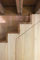 Wooden staircase and exposed beams 