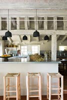 Exposed wooden beams in modern country kitchen 