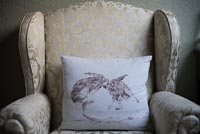 Armchair with hare cushion