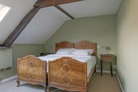 Twin bedroom with walnut bedframes