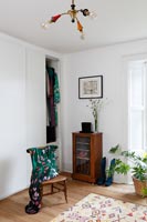 Built-in wardrobes and vintage furniture in classic bedroom 