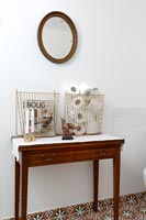 Console table and mirror in classic bathroom 