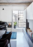 Small grand piano in open plan modern apartment