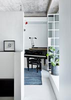 Small grand piano in modern apartment 