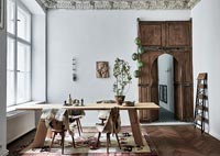 Dining room with decorative wooden door 