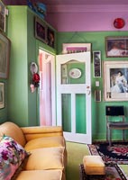 Colourfully painted living room with glazed internal door 