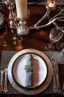 Place setting on classic dining table 