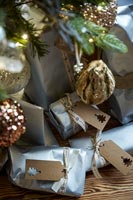 Close up of gifts under the Christmas tree and decorations 