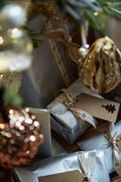Close up of gifts under the Christmas tree and decorations 