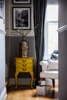 Yellow side table in classic bedroom 