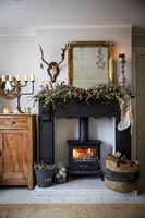 Country living room with fireplace decorated for Christmas 