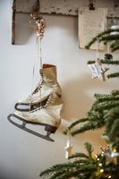 Vintage ice skates displayed as Christmas decoration