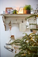 Vintage ice skates and pages of old book displayed as Christmas decoration